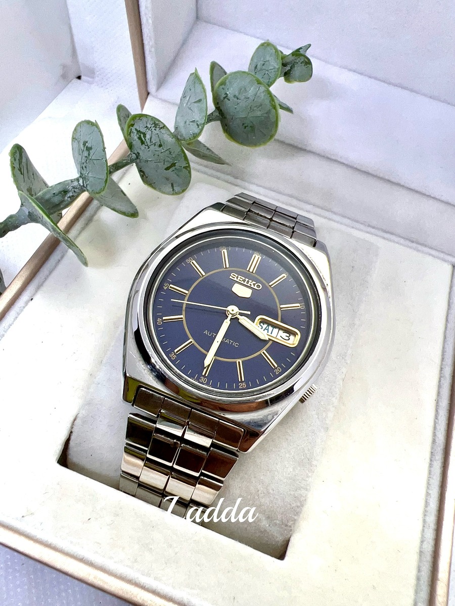 นาฬิกา Seiko 5​ Automatic กลไกลระบบเครื่อง 7009  หน้า​ปัดสีกรม หลักทอง